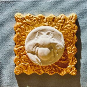 bee on gold and blue