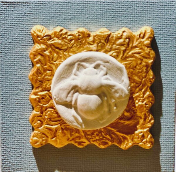 bee on gold and blue